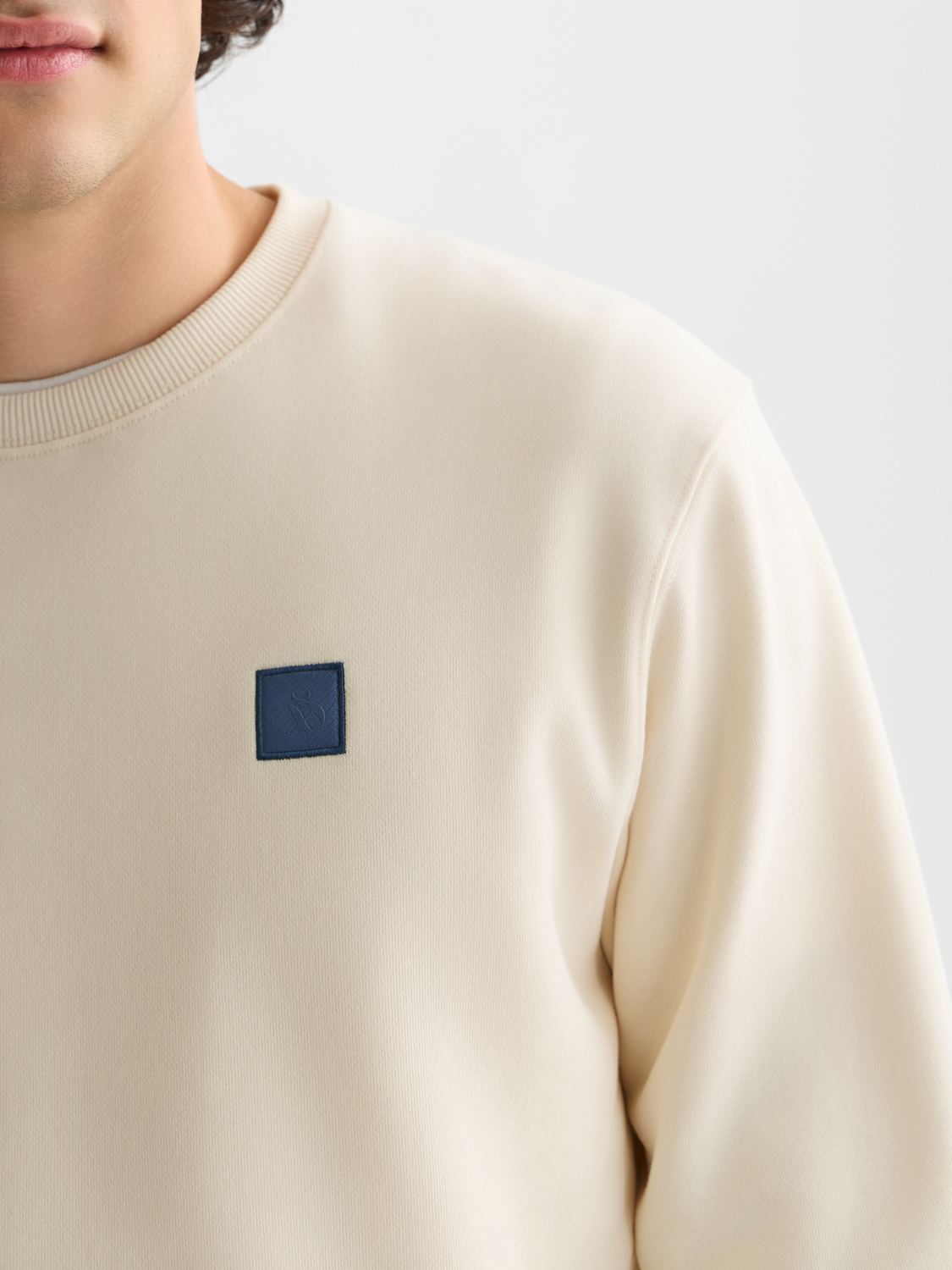 Seasonal Essentials logo badge sweatshirt