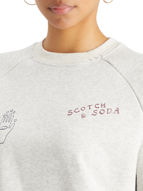 EMBROIDERED RAGLAN RELAXED FIT SWEATSHIRT