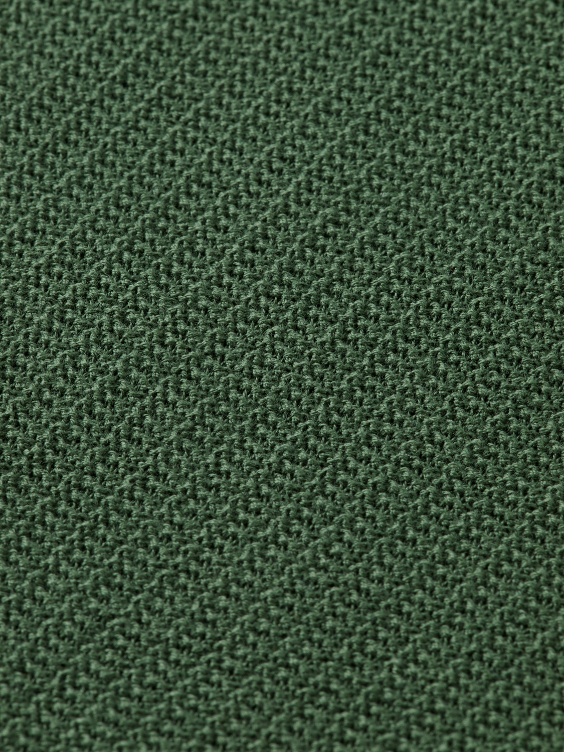 Structured knitted solid polo