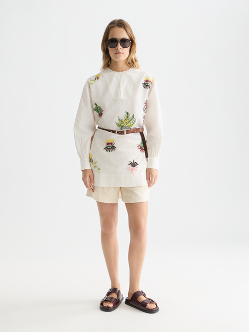 Embroidered short bib dress